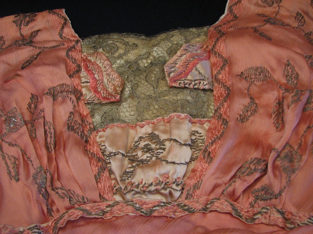 The outside layers of the bodice were constructed over the boned foundation, giving the appearance of a soft kimono sleeve over the lace insert.