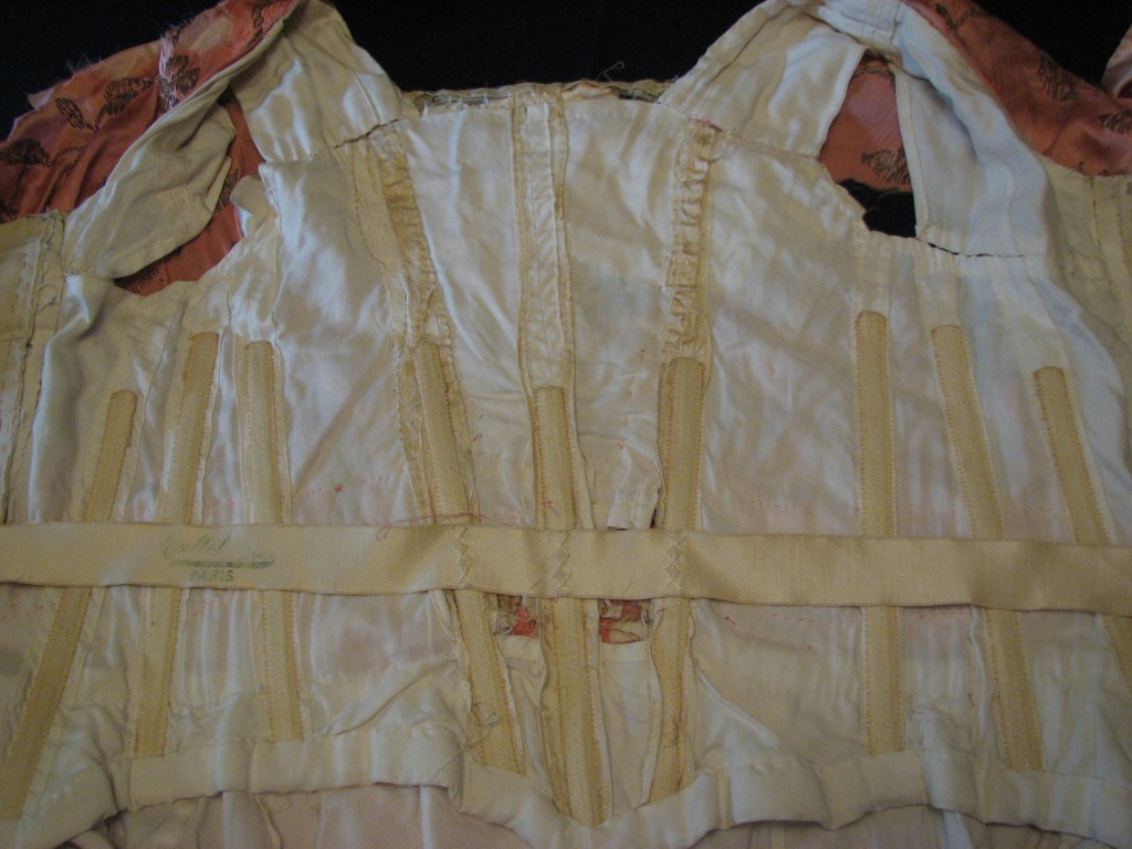 The inside of the bodice showed 19th century contstruction and boning.